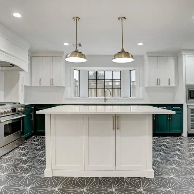 Emerald green kitchen with waterfall island